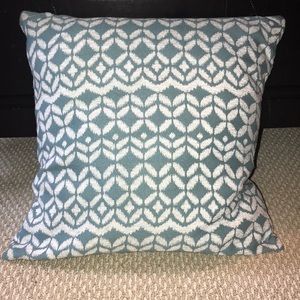 Teal and white decorative pillow